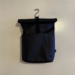 Black Minimalist Backpack with Zippered Closure